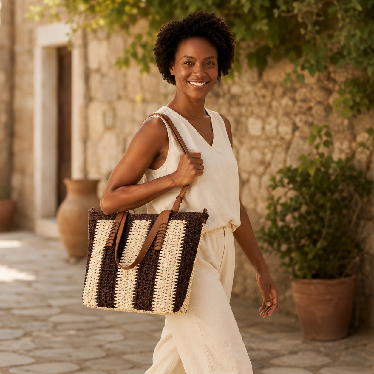 Model wearing the Antibes - Straw Beach Tote, side view
