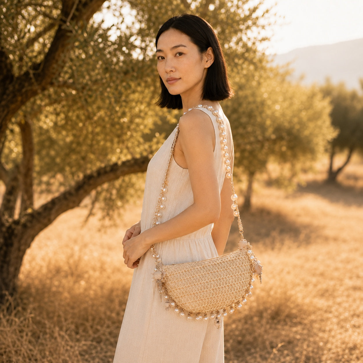 Model wearing the Boccadasse - Straw Crossbody Bag, side view