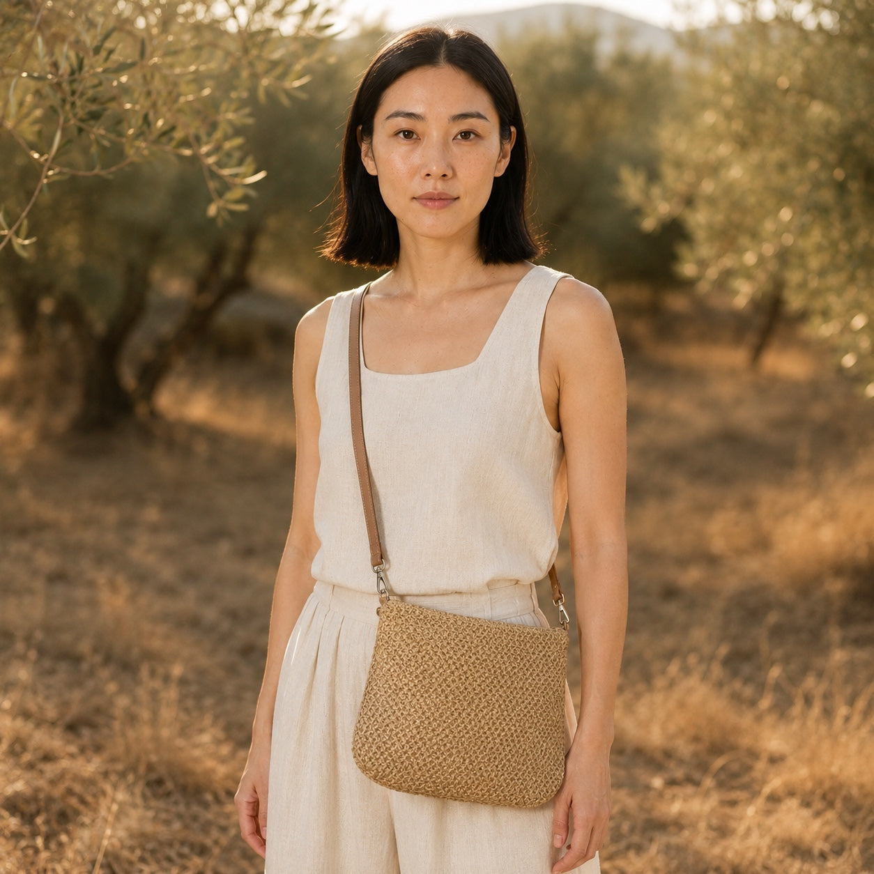 Model carrying the Bodrum - Straw Crossbody Bag