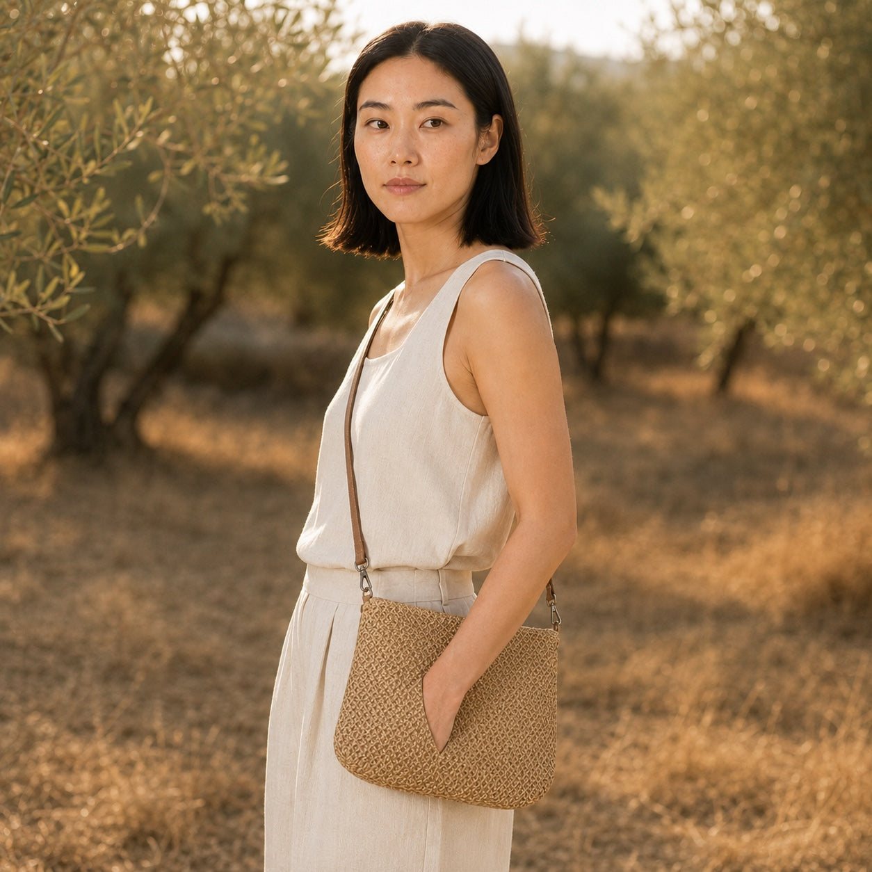 Model wearing the Bodrum - Straw Crossbody Bag, side view