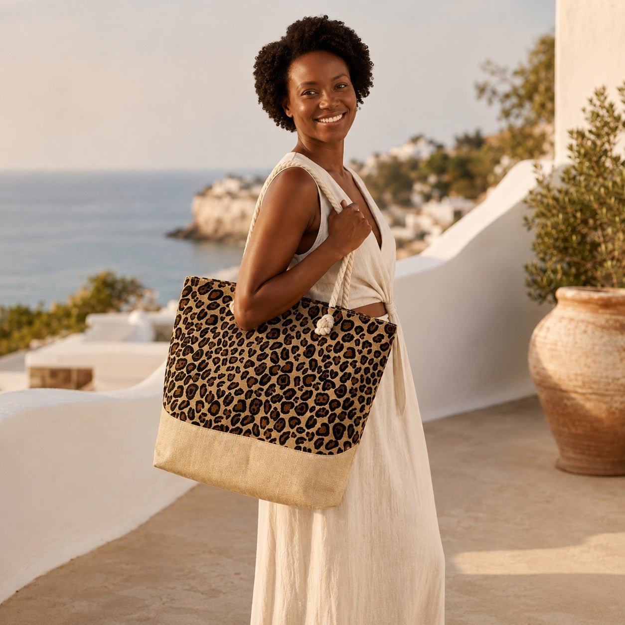 Model wearing the Calvi - Straw Beach Tote in Leopard Print, side view