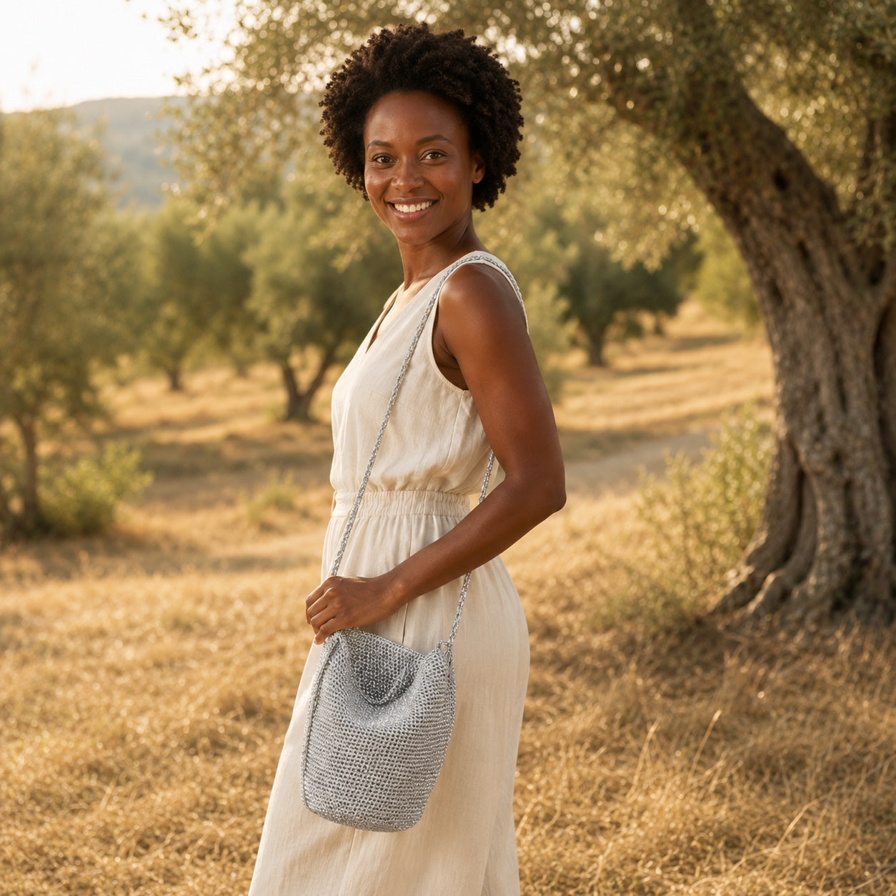 Model wearing the Cascais - Straw Bucket Bag, side view