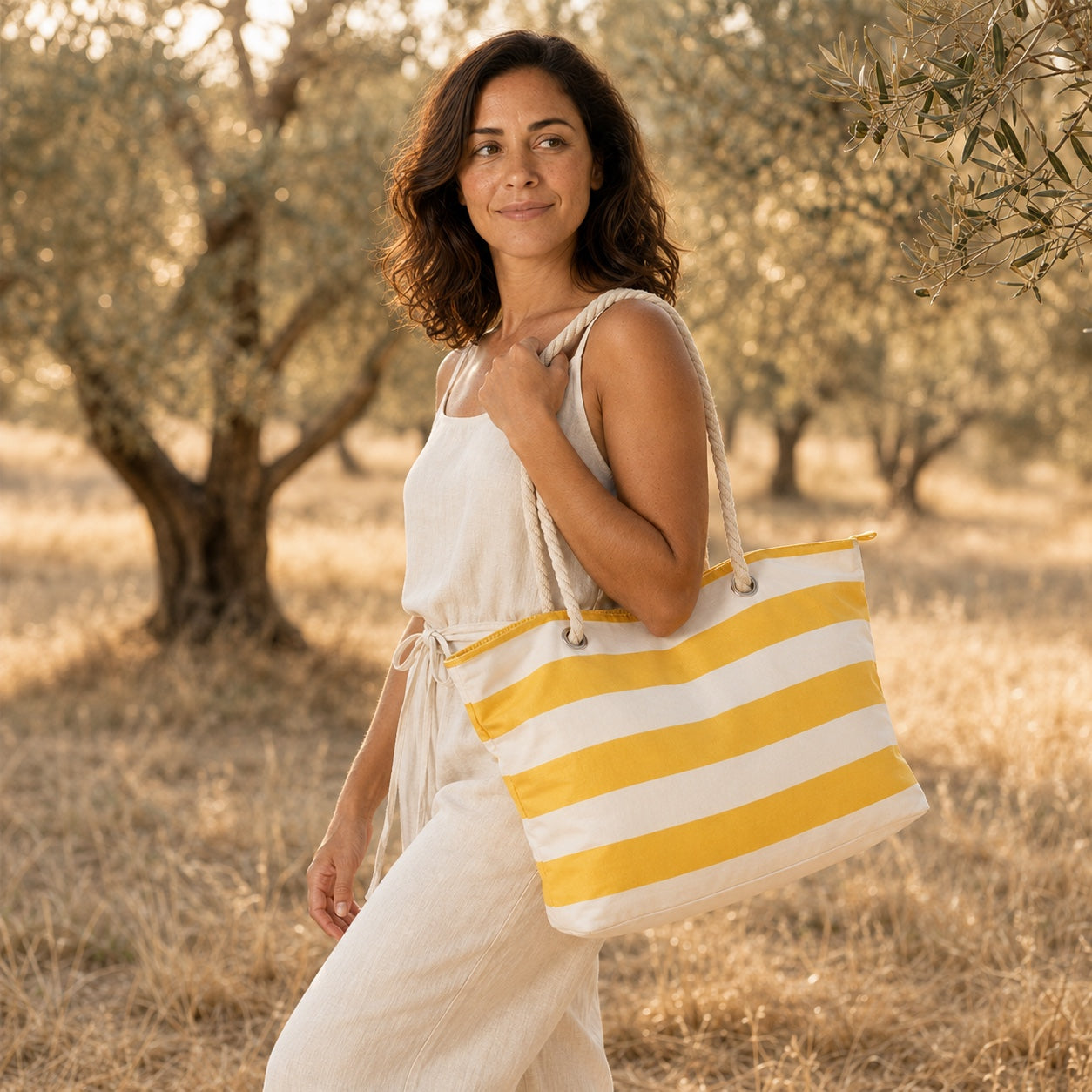 Model wearing the Ischia - Straw Beach Tote, side view
