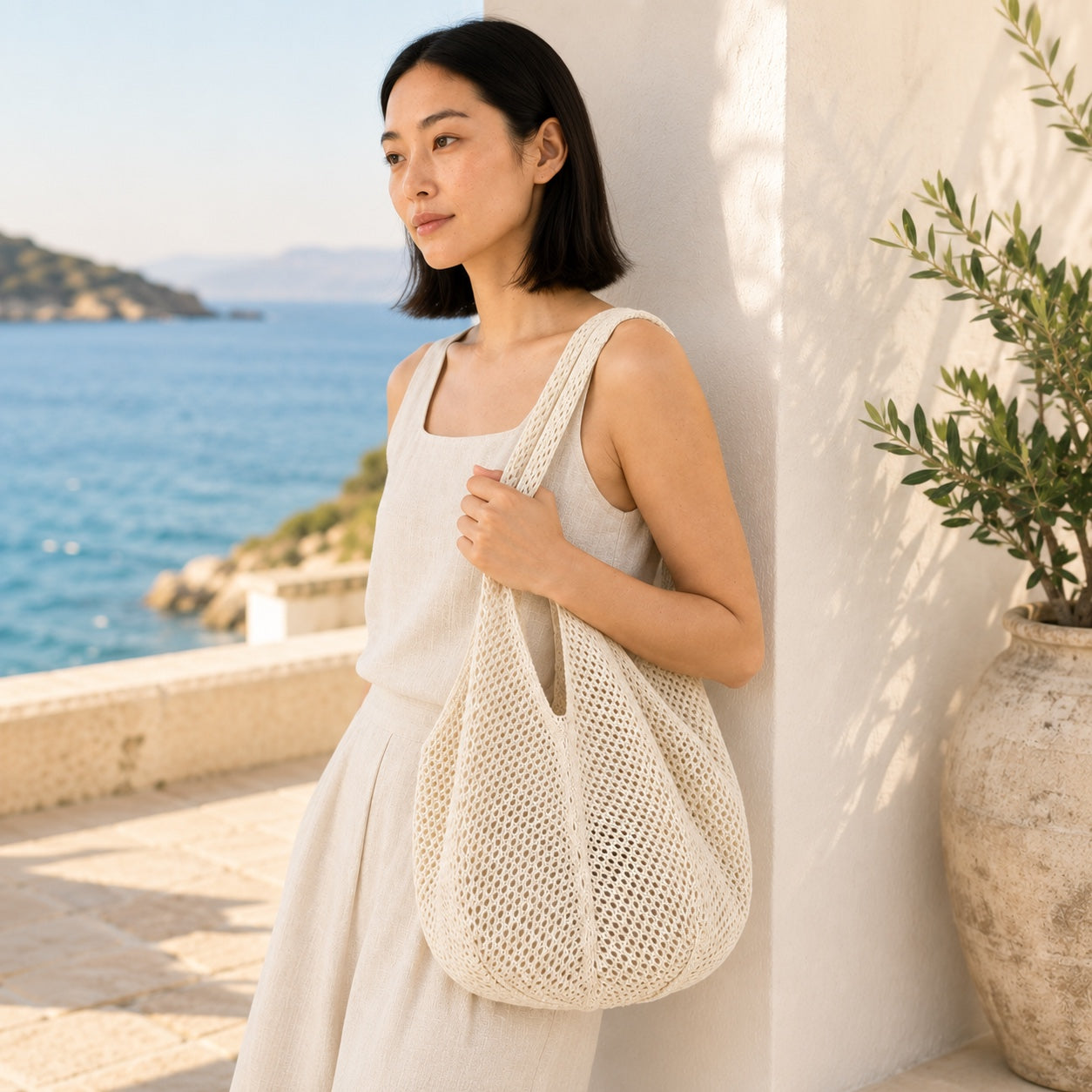 Model wearing the Koroni - Rattan Clutch, side view