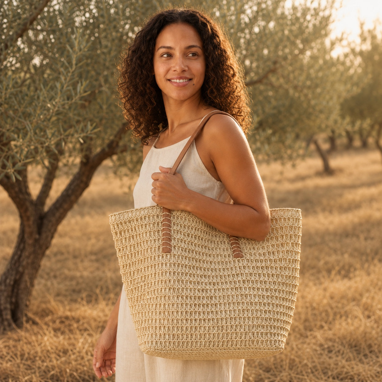 Model wearing the Orosei - Crochet Tote Bag, side view
