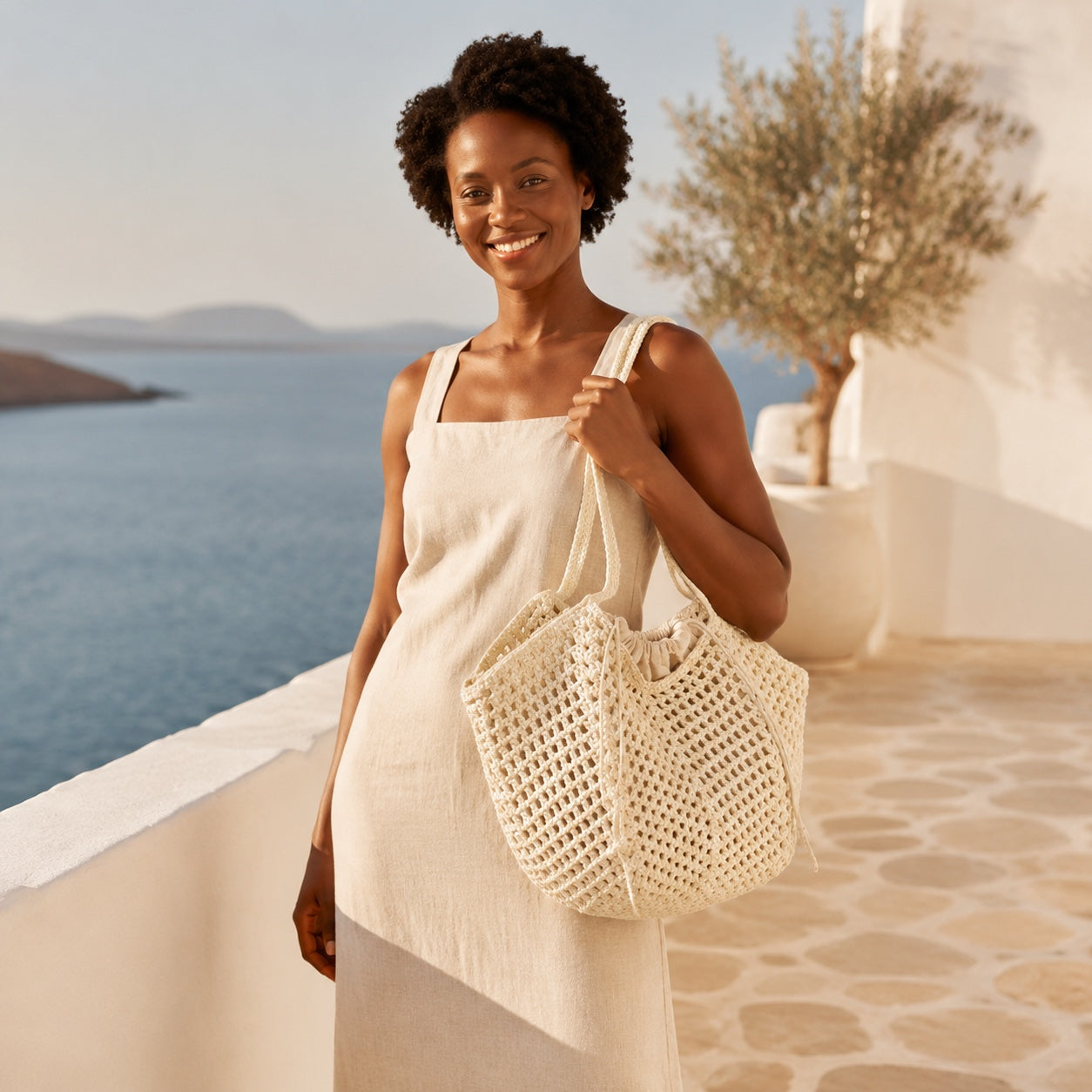 Model carrying the Porec - Woven Beach Tote