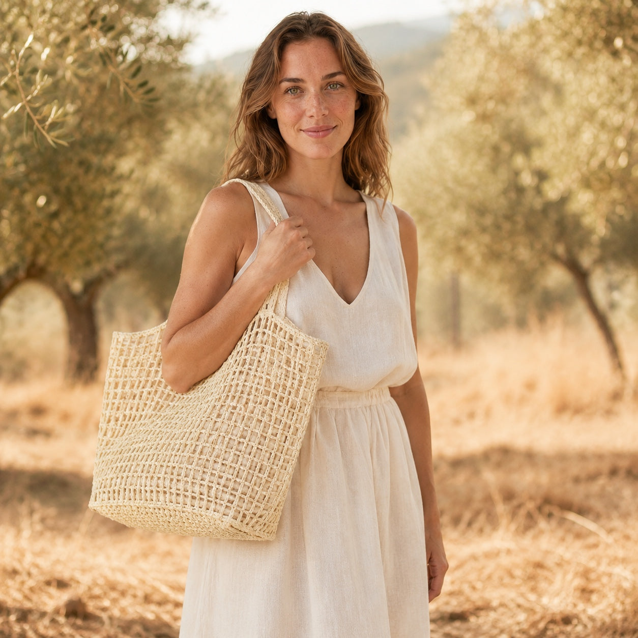 Model carrying the Portovenere - Straw Tote Bag