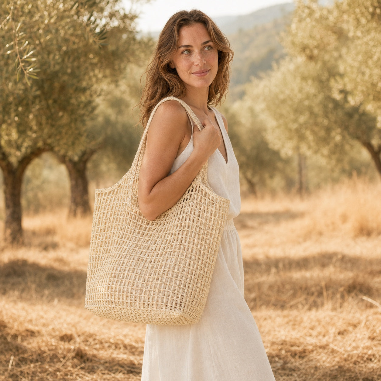 Model wearing the Portovenere - Straw Tote Bag, side view