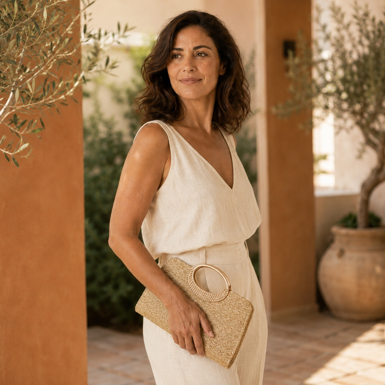 Model wearing the Santorini - Straw Clutch in Khaki, side view