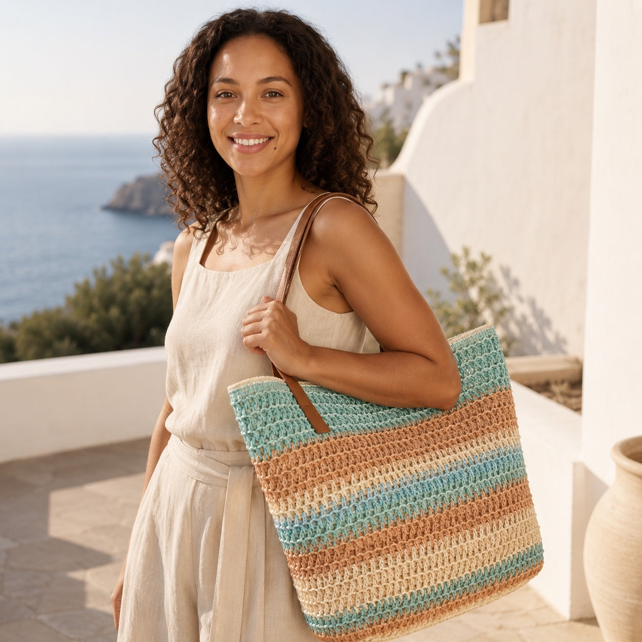 Model carrying the Tinos - Straw Beach Tote